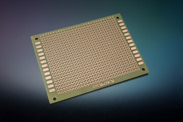 empty clear universal prototype printed circuit board on background