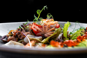 Seafood salad with avocado, shrimp, scallops, octopus