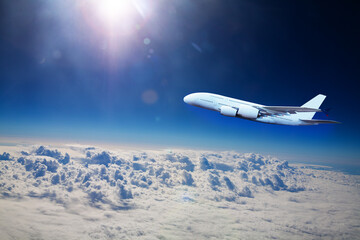 Big jet plane fly above clouds at high altitude