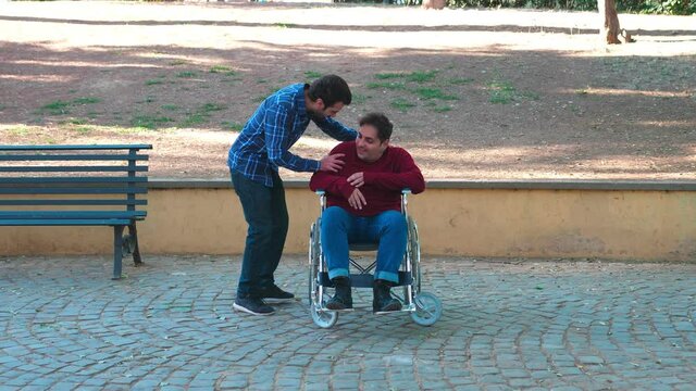 helpless guy with disability-woman protects a young man from a pushy friend