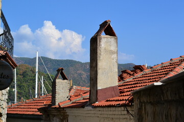 Tiled roof, mountains and blue sky
