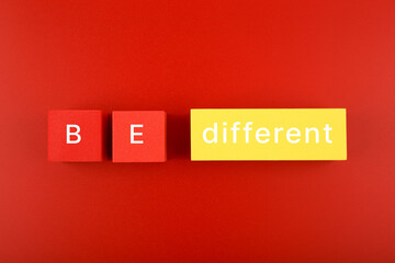 Concept of individuality, brainstorming, fresh ideas and being different from others on red...