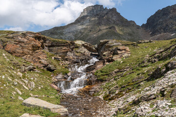 Vals, Switzerland, August 21, 2021 Little waterfall in the alps