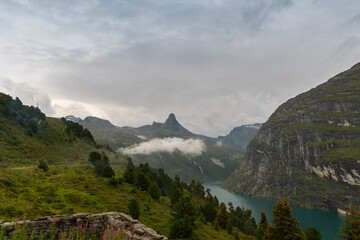 Vals, Switzerland, August 22, 2021 Fog around the mount Zervreila in the morning