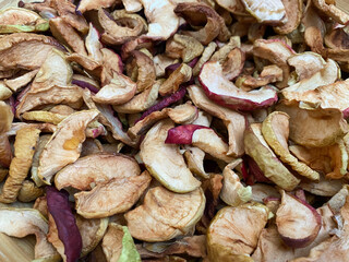 Background of dried apples in close-up. Texture of dried apples