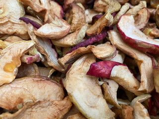 Background of dried apples in close-up. Texture of dried apples