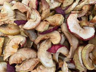 Background of dried apples in close-up. Texture of dried apples