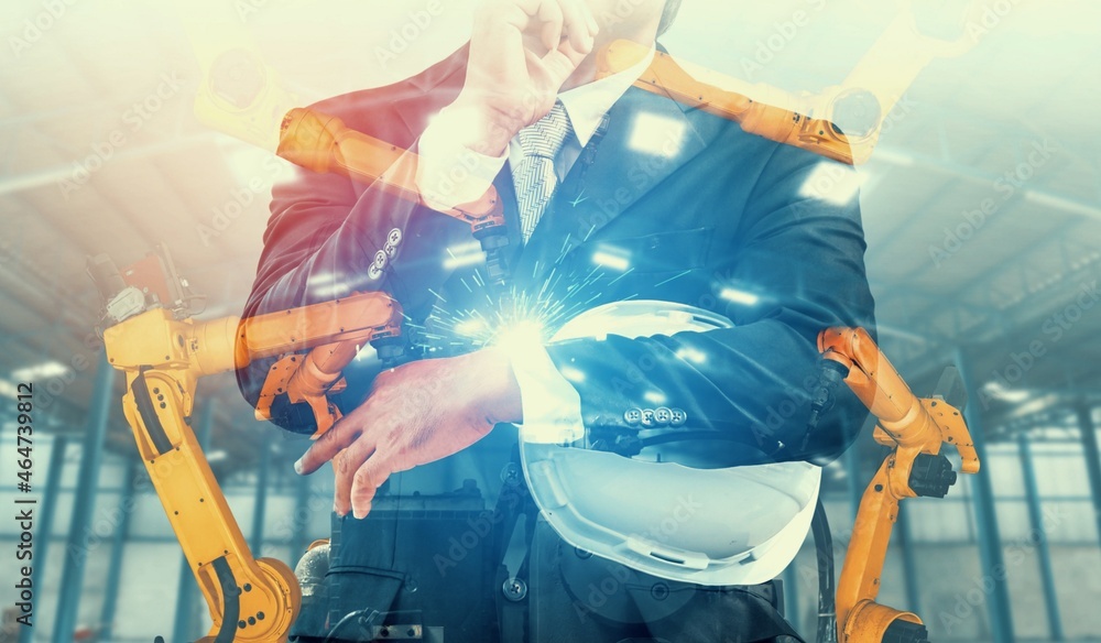 Poster mechanized industry robot arm and factory worker double exposure . concept of robotics technology fo