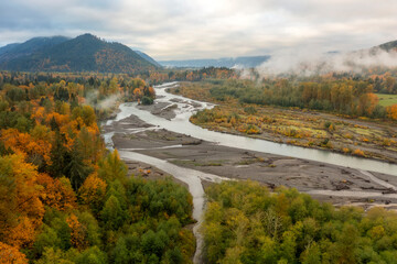 Fototapeta na wymiar Aerial View of the Magnificent Nooksack River Valley During the Autumn Season. Fall color adds to this beautiful scenic drive up the Mt. Baker Highway to the recreation area of the Pacific Northwest.