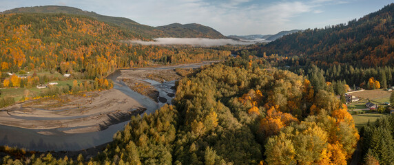 Obraz premium Aerial View of the Magnificent Nooksack River Valley During the Autumn Season. Fall color adds to this beautiful scenic drive up the Mt. Baker Highway to the recreation area of the Pacific Northwest.