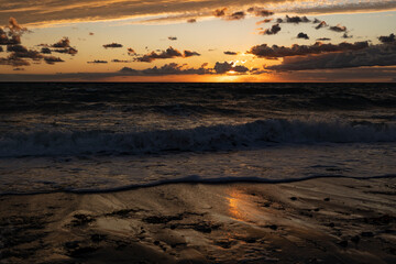 Sunset on the sandy beach of the Baltic Sea, island Fehmarn, Germany