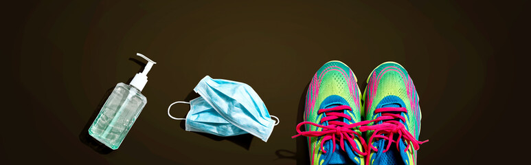 Fitness and coronavirus theme with running shoes - flat lay