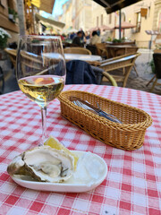 Oyster with wine on the restaurant table