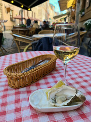 Oyster with wine on the restaurant table