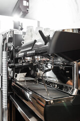 Close up of traditional Espresso Coffee Machine. Flowing fresh ground coffee. Drinking roasted black coffee in the morning.