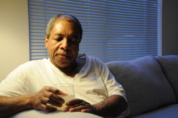 African american man eating dinner at home.