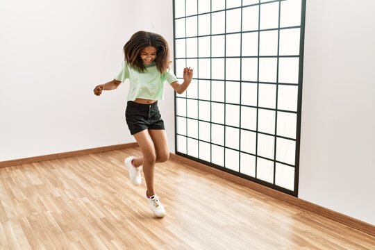 African American Girl Smiling Confident Dancing At Dance School