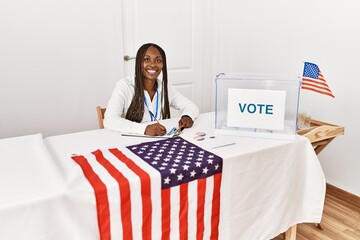 Young african american politic party worker working at electoral college.