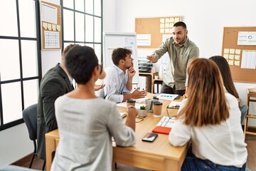 Group of business workers listening boss conference during meeting at the office.