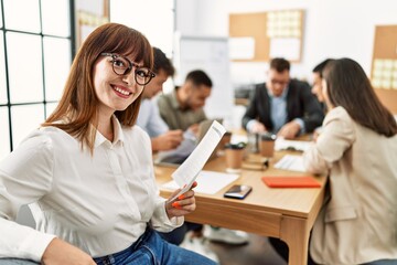 Group of business workers smiling happy working at the office.