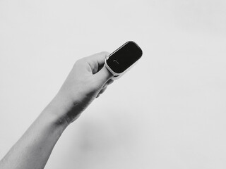 A hand with pulse oximeter