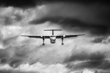A plane is landing on a stormy day. Strong cloud background, aircraft, runway, approaching, brave, aeroplane, airliner, could, storm, sky, flying