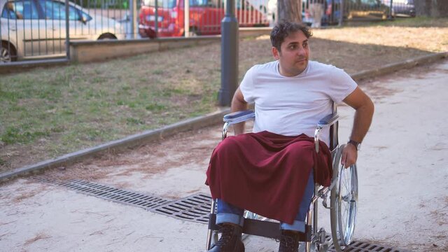 defend a disabled person - slow motion on pushy man annoying a disabled man who is defended by a young woman