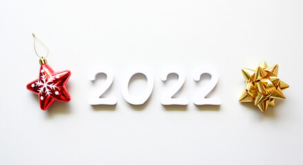 2002 New Year's stars and bow on white table New Year's Eve Concept