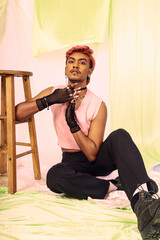 Malaysian Indian men posed in front of a cloth backdrop in a studio setting