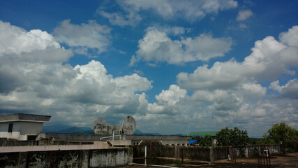 Cumulus clouds in the blue sky at noon