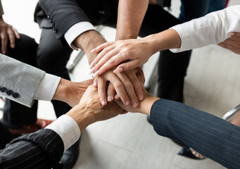 Power of the new generation, Team work, Join forces to achieve the goal. Business people, managers, employees shaking hands, energizing in a circle. 