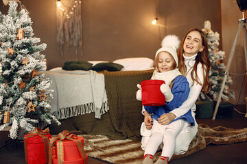 Mother with little daughter at home