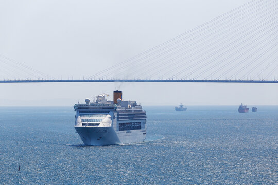 Summer, 2017 - Vladivostok, Russia - Superliner Diamond Princess Passes Under The Russian Bridge In Vladivostok. Passenger Liner In Vladivostok.