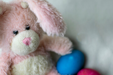 Easter pink bunny with blue eggs. Easter concept.