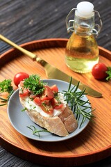 Tasty Savory Tomato Italian Appetizers, or Bruschetta, on Slices of Toasted Baguette Garnished with Parsley