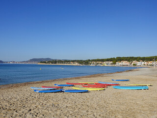 The beach and bay of Saint Cyr Les Lecques and its surfboards.