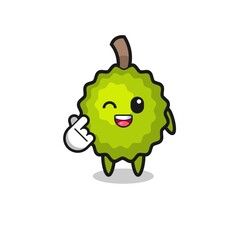 durian character doing Korean finger heart
