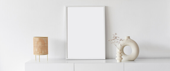 Blank picture frame mockup on white wall panoramic banner. White living room design. View of modern...