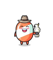 candy zookeeper mascot with a parrot