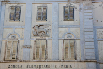 Facade of old elementary school in Buje, Istria, Croatia
