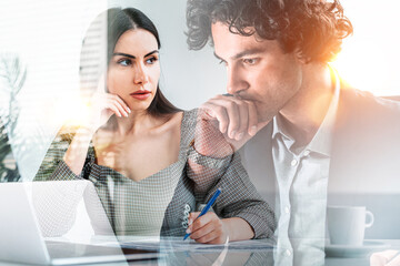 Businesswoman wearing formal suit and businessman work together