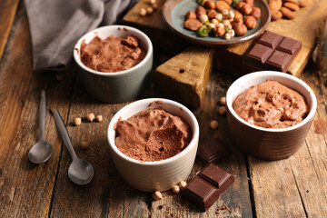 delicious homemade chocolate mousse on wood background