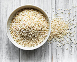 Sesame seeds in a bowl  on a rustic table
