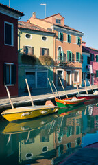 Fototapeta na wymiar Boats on the canal on the island of Burano