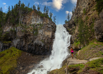 Rear view of a woman hiker resting in Yellowstone National Park, USA