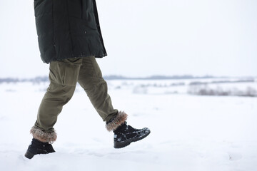 Bearded man in the winter woods. Attractive happy young man with beard walk in the park.