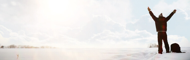 A man on a walk. Winter landscape. Tourist in winter journey.