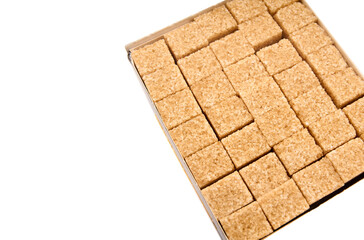 Refined sugar cubes on white background. Brown sugar cubes in background
