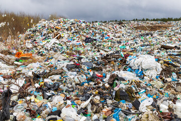 Verkhnie-Sergi, Russia - May 02, 2021. a large trash heap of various waste and plastic bags. dangerous pollution of the environment and nature