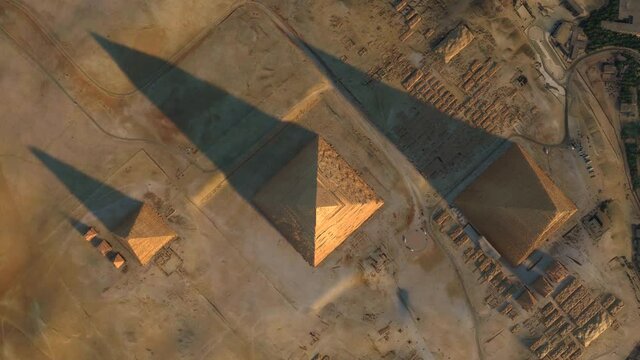 Aerial top down view of The Giza Pyramid Complex also called the Necropolis is the site Greater Cairo Egypt that includes the Great Pyramids Khafre Menkaure and the Sphinx 4k high resolution animation